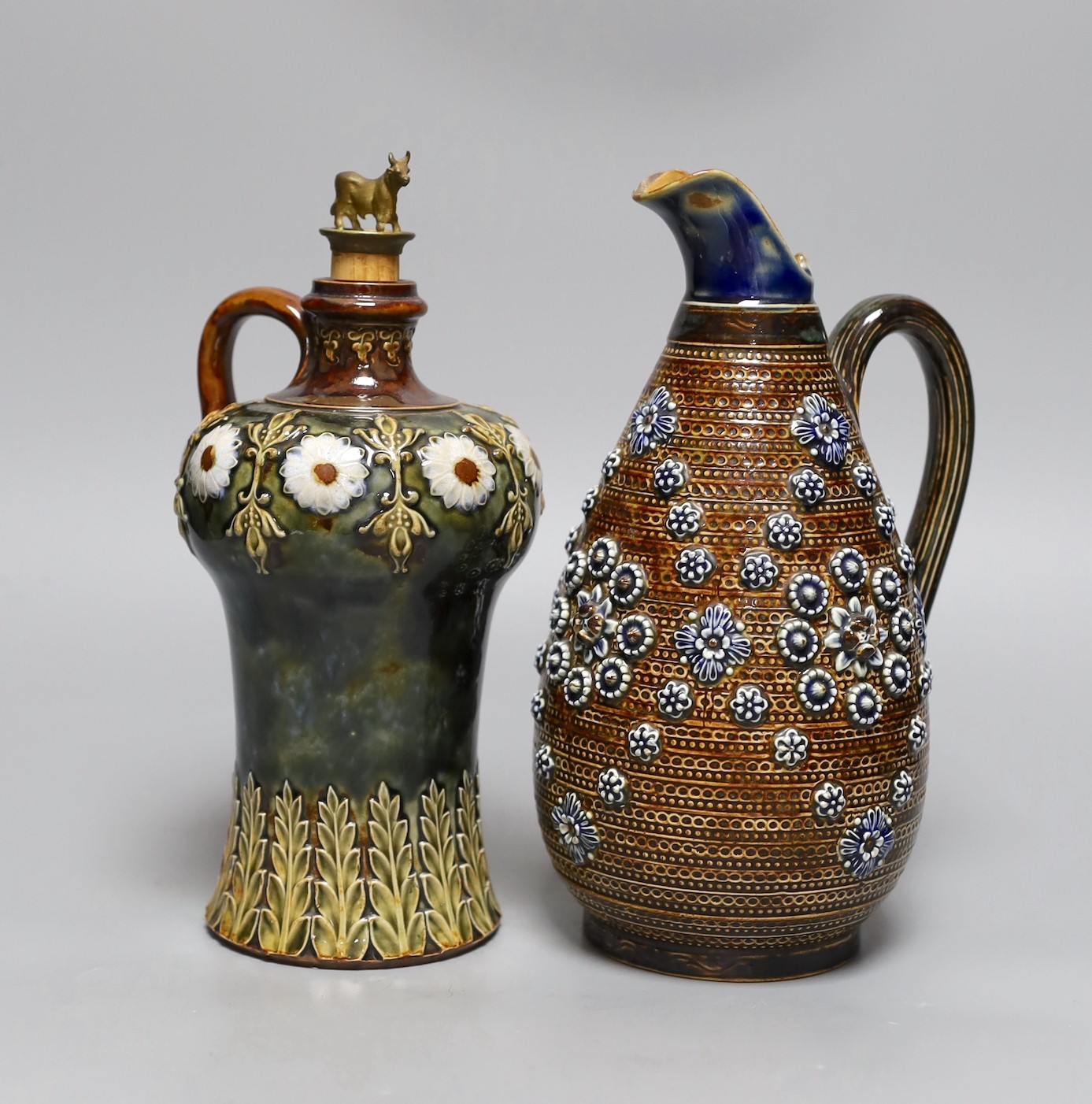 A Doulton Lambeth stoneware decanter and a similar jug, dated 1877, jug 24cms high